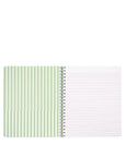 Notebook with green striped and plain white pages on a white background