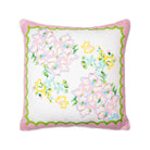 Decorative pillow with floral pattern and pink border on a white background