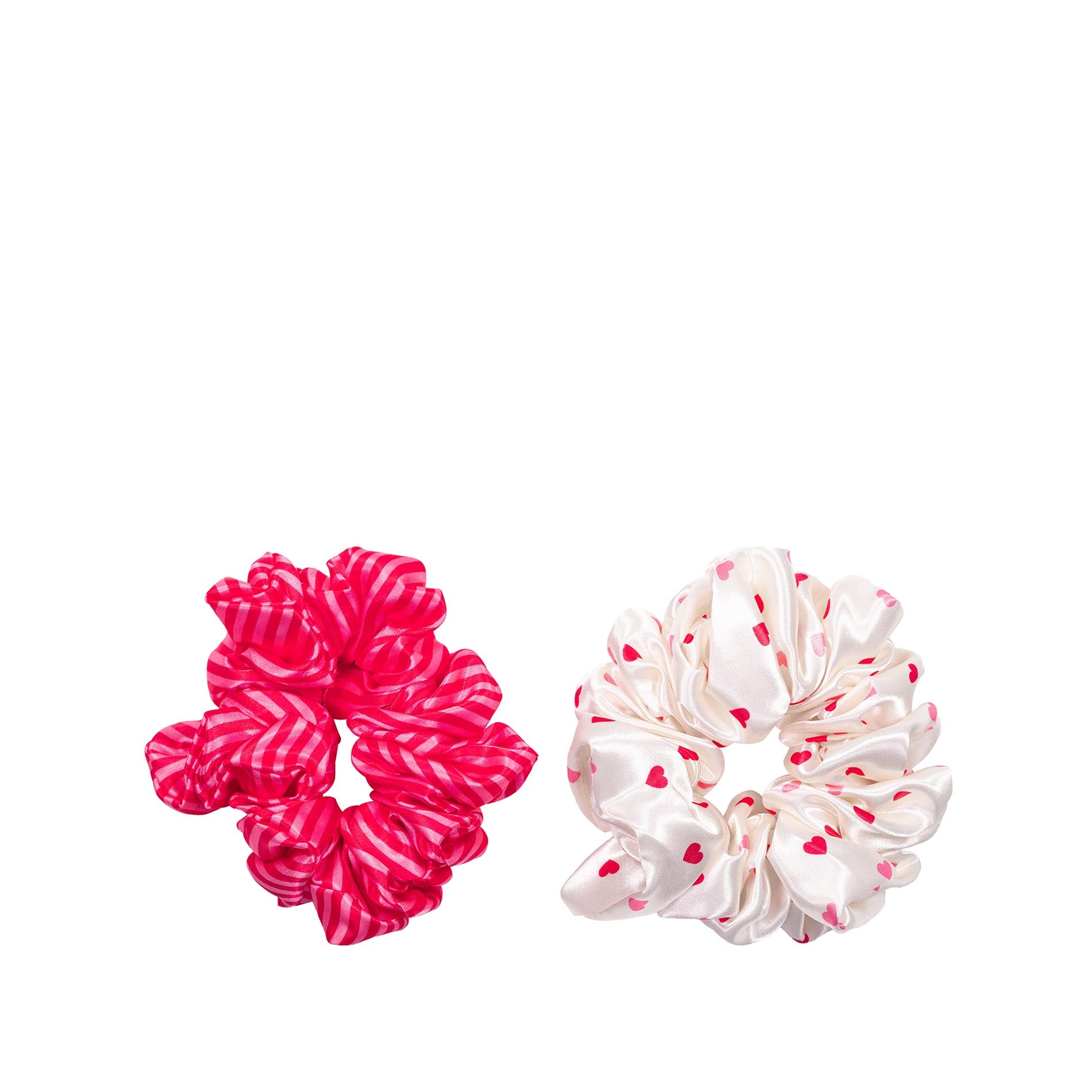 Two scrunchies, one pink with white stripes and one white with red heart patterns, on a white background.