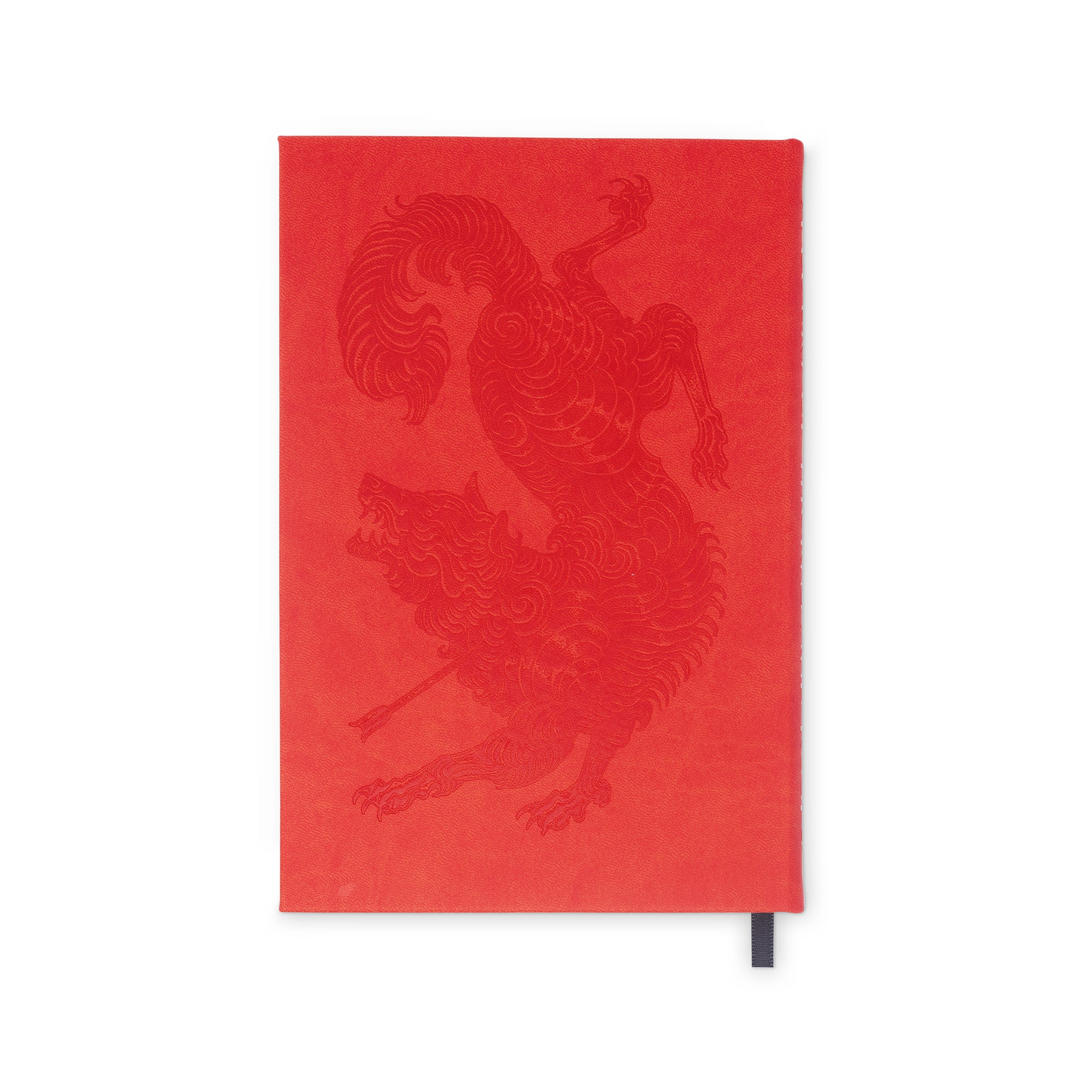 Red notebook with a dragon design on a white background