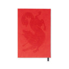 Red notebook with a dragon design on a white background