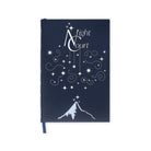 Navy blue notebook with white star design and mountain illustration on a white background