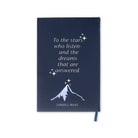 Navy blue book with white text and mountain illustration on a white background