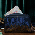 Navy blue bag with 'City of Starlight' design on a dark background