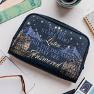 Navy blue pouch with mountain and star design, featuring text on a white background