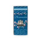 A rectangular ceramic candle with rounded corners featuring a blue and white design inspired by Jane Austen's 'Persuasion'. The design includes a pink rose and foliage pattern, a white sailing ship, and the text 'Persuasion' and 'JANE AUSTEN'.