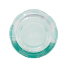 Bottom view of mint glass on a white background