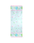 Floral patterned towel with a pink border on a white background