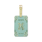 mint green luggage with 'GEMINI' 'THE TWINS'