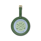 Green round luggage tag with golf club design and text on a white background