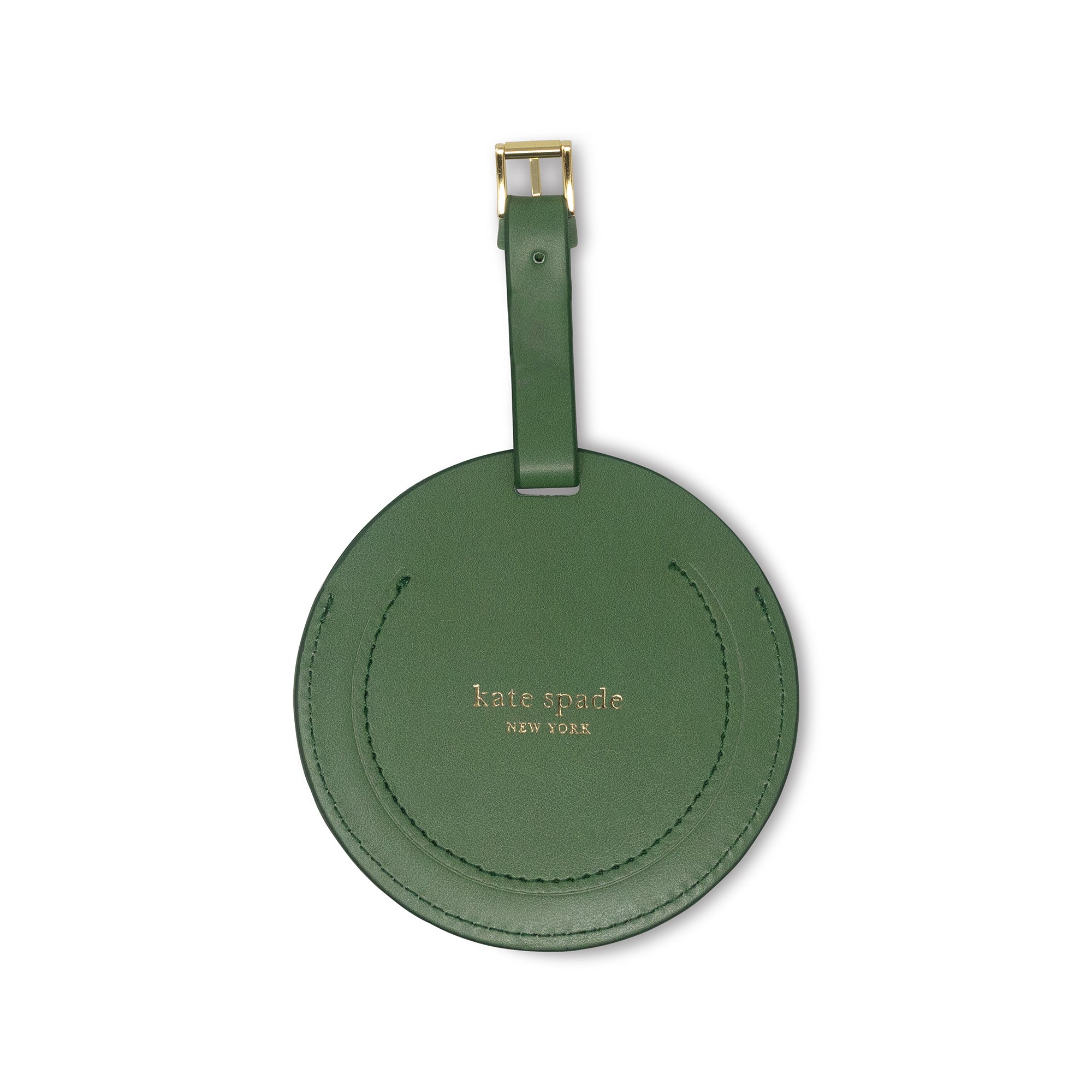 Green round luggage tag with 'kate spade New York' branding on a white background