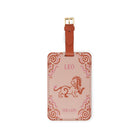tan/pink luggage tag with 'LEO' and 'THE LIO' with a lion image