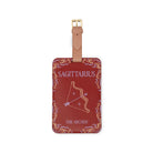 red luggage tag that says 'Sagittarius' and 'THE ARCHER' with archer image