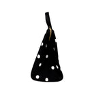 side view of black lunch bag with white polka dots