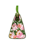 Floral-patterned bag with a green strap on a white background