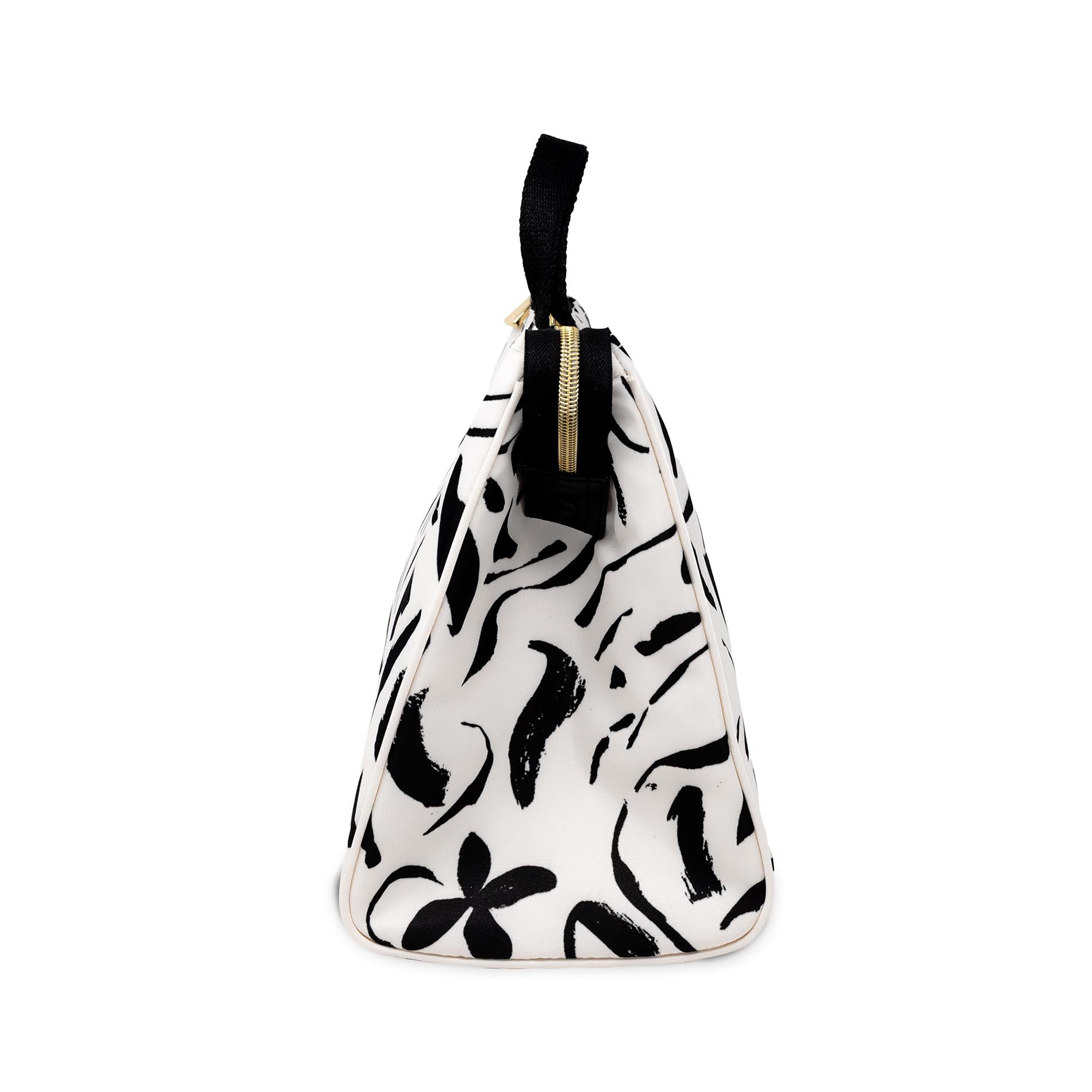 Sideview of white lunch bag with black floral pattern on a white background