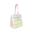 Tote bag with colorful square patterns on a white background