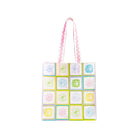 Tote bag with colorful floral pattern on a white background