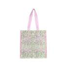 A light green and pink patterned reusable shopper bag with pink handles, shown on a plain white background.