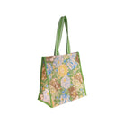 side view of mesh market bag with green trim and retro floral and sun print
