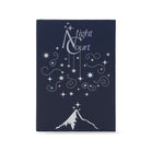 A dark navy blue book packaging with a silver and white celestial design featuring stars, swirls, a mountain peak, and the words 'Night Court' on the front, set against a plain white background.