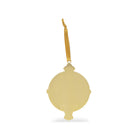 back view of suriel trading co. embossed gold ornament with gold hanging ribbon