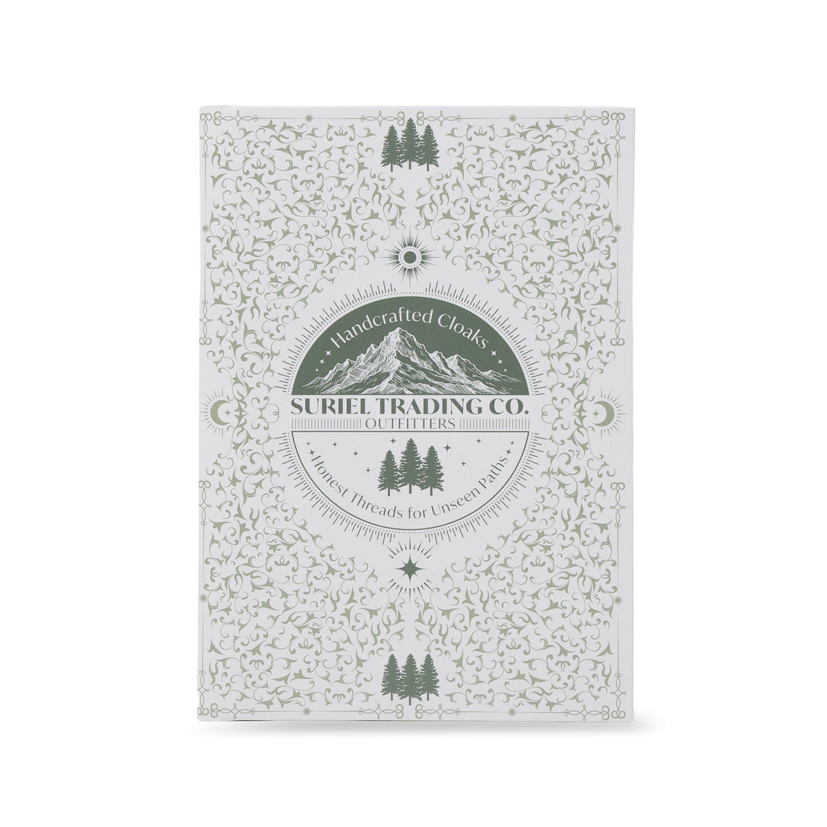 A rectangular book packaging with a white background and an intricate sage green floral and mountain pattern. The center features a circular logo for 'Suriel Trading Co.