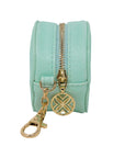 Mint green keychain pouch with gold zipper and keychain on a white background