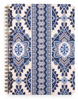 Notebook with blue and beige pattern on a white background