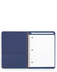 Blue notebook with a spiral binding on a white background