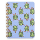 Notebook with green turtle pattern on a blue background