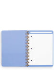 Open notebook with light blue cover and white pages on a white background