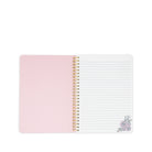Open notebook with pink cover and white pages on a white background