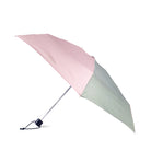 Two-toned pink and green umbrella on a white background