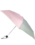 Two-toned pink and green umbrella on a white background