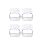 Four white sun napkin ring set on a white background, branded 'Lilly Pulitzer'.
