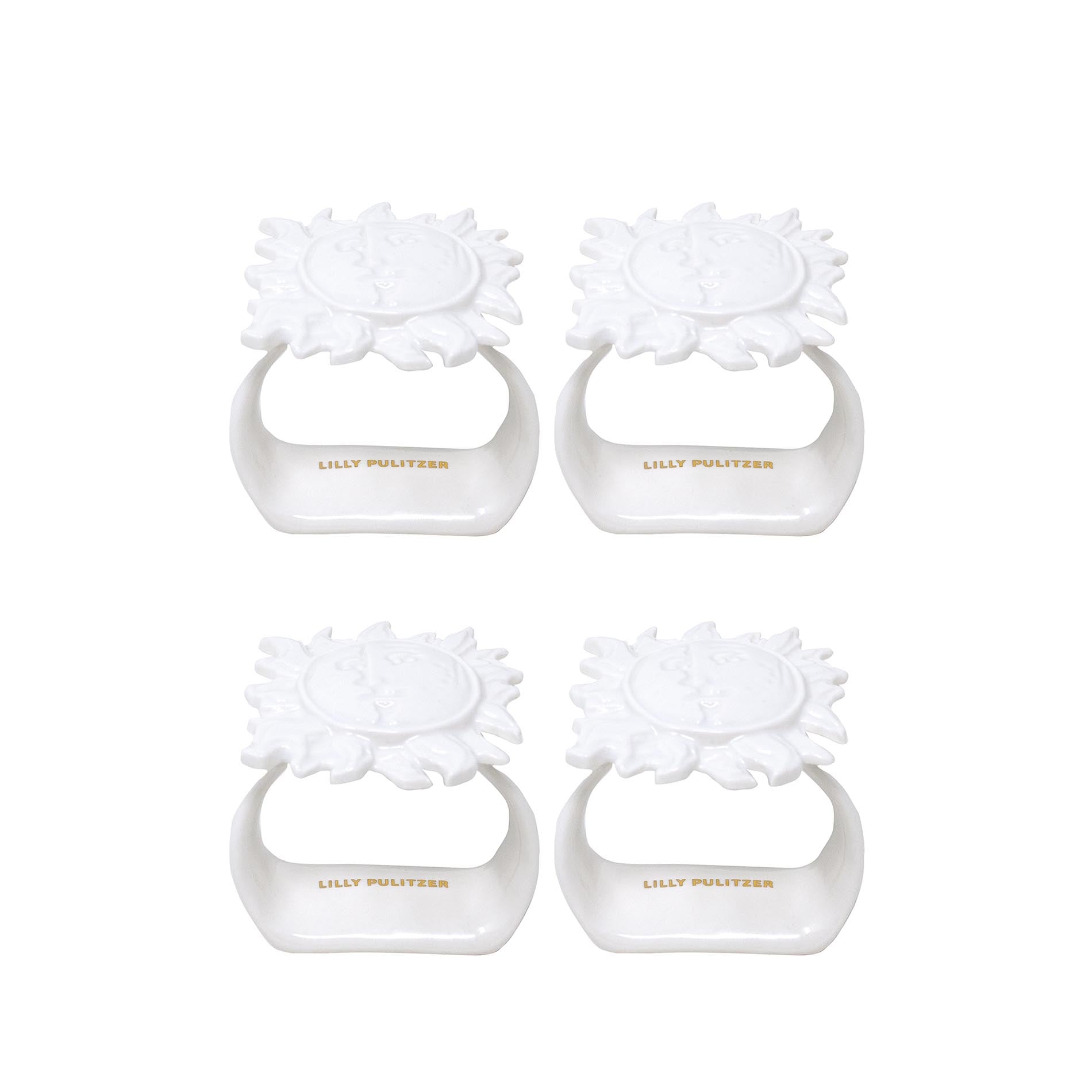 Four white sun napkin ring set on a white background, branded 'Lilly Pulitzer'.