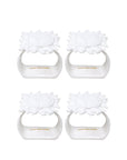 Four white sun napkin ring set on a white background, branded 'Lilly Pulitzer'.