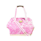 pink and white floral print cooler bag with whit strap with ric rac detail and gold bottom