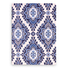 Notebook with blue and white geometric pattern on a white background