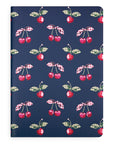 Notebook with cherry pattern on a blue background