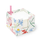 white notecube with sketch floral print and pink pen