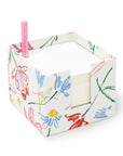 white notecube with sketch floral print and pink pen