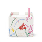back view of white notecube with sketch floral print and pink pen