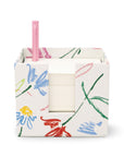 front view of white notecube with sketch floral print and pink pen