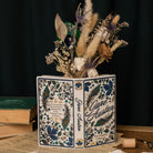 Jane Austen open book vase with dried flowers inside
