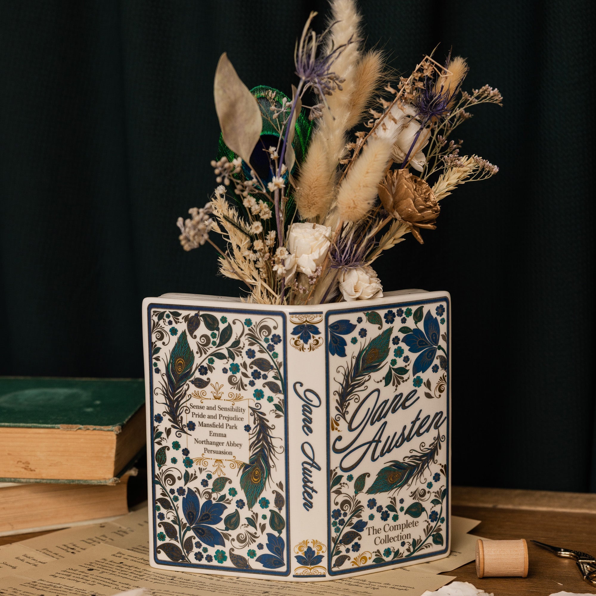 Jane Austen open book vase with dried flowers inside