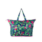 A large tote bag with a vibrant tropical fruit and leaf print on a navy blue background, featuring pink accents and dual shoulder straps, shown against a plain white background.