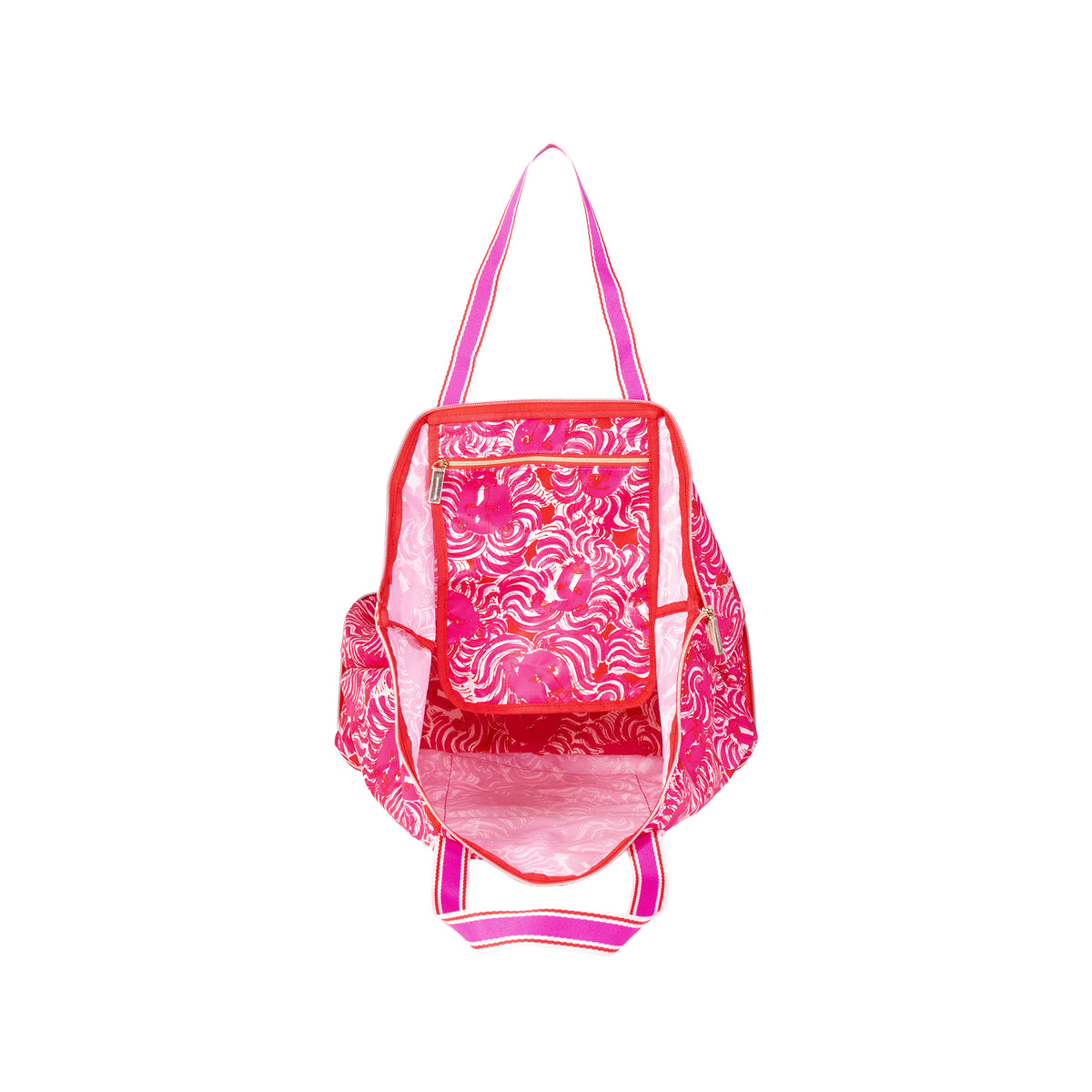 A pink and white patterned tote bag with bright pink handles and trim, shown from the front on a plain white background.