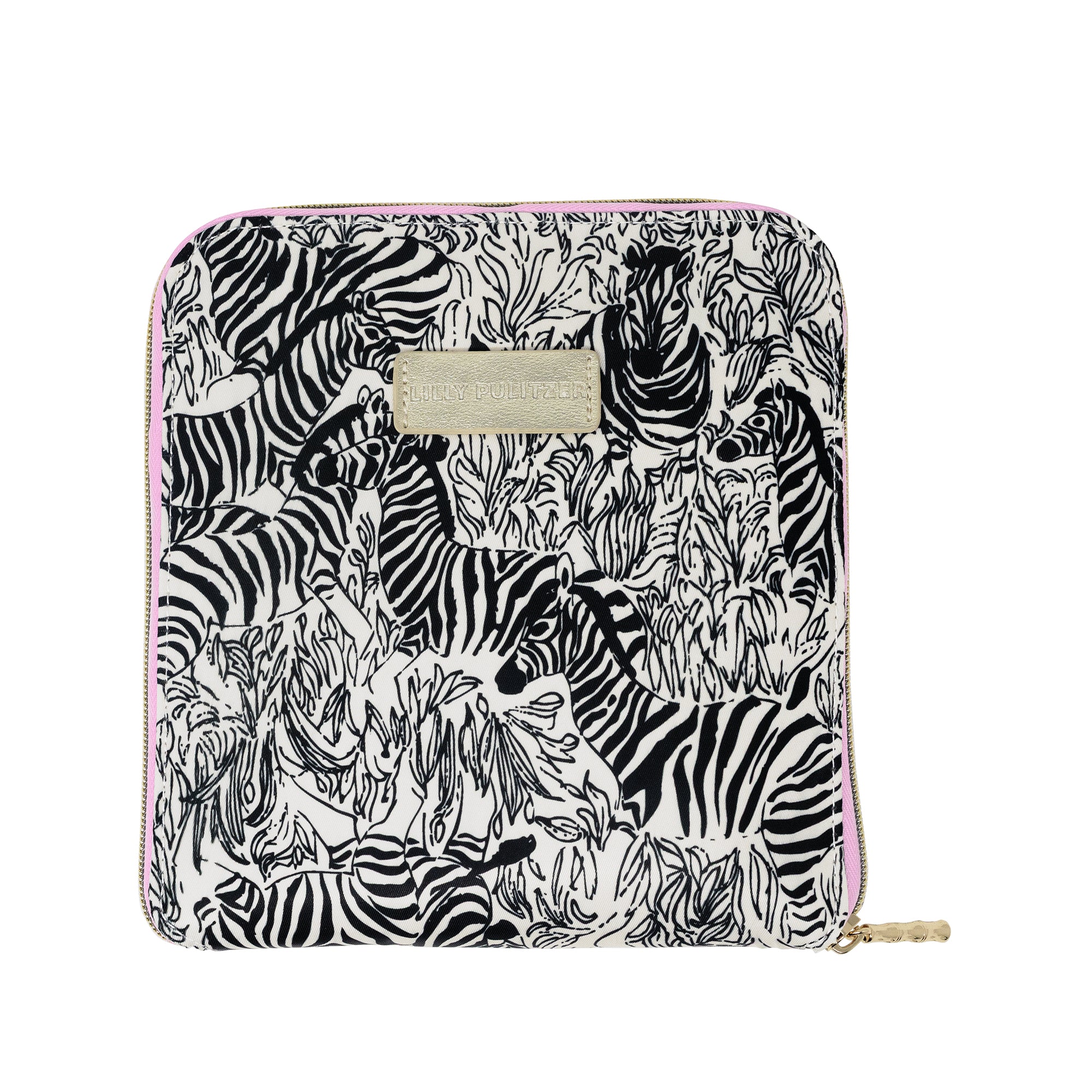 A zippered pouch featuring a black and white zebra print on a white background, with a light pink zipper trim and a gold-tone metal brand plaque on the front.